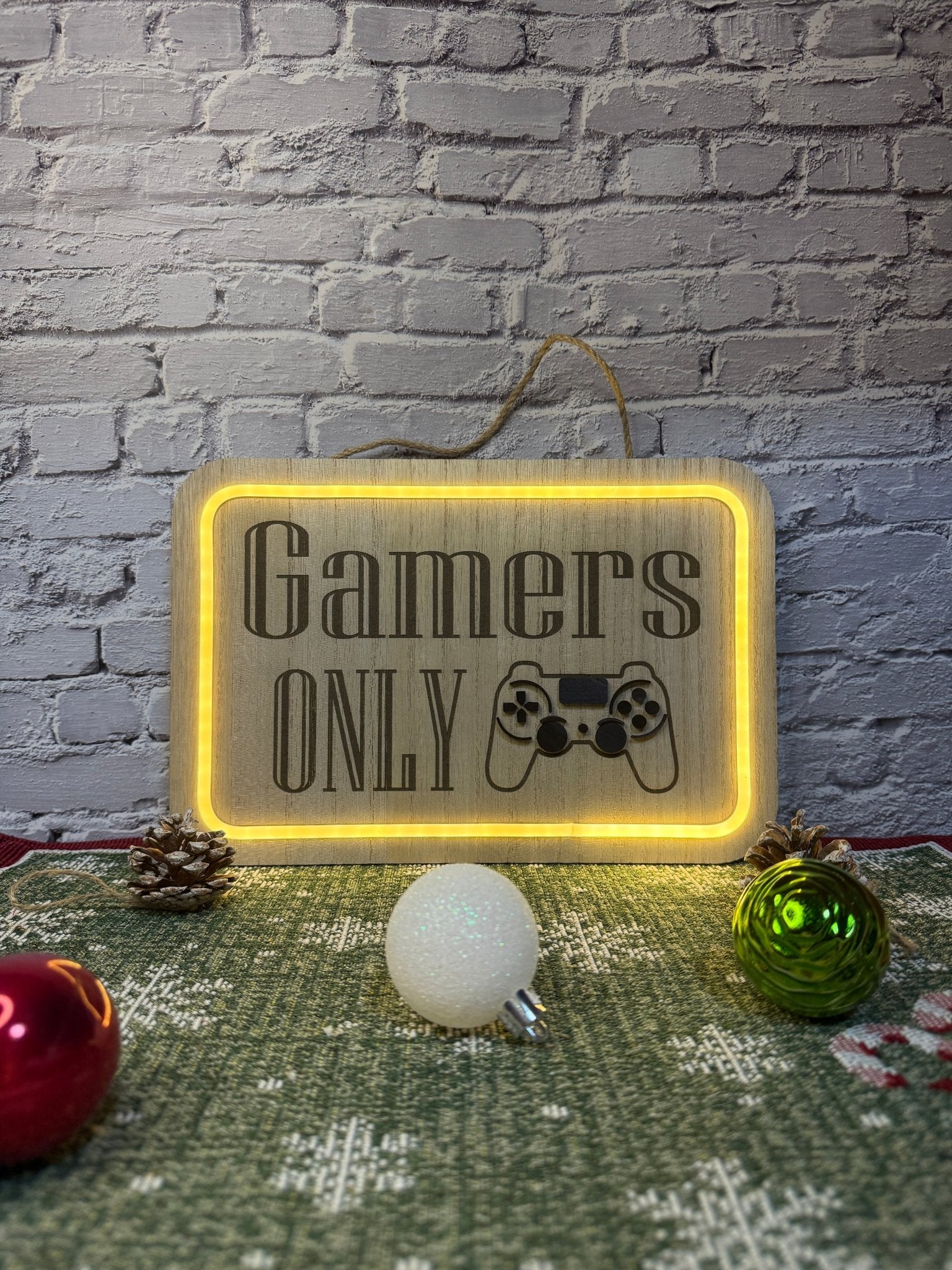 Lighted bedroom sign laser engraved with text gamers only and controller lit up