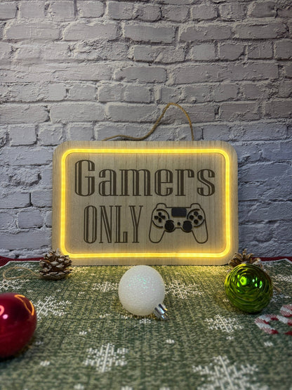 Lighted bedroom sign laser engraved with text gamers only and controller lit up