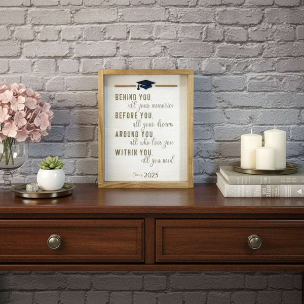 Laser engraved and cut framed wood graduation sign that reads behind you, all  your memories, before you, all your dreams, around you, all who love you, within you, all you need. 