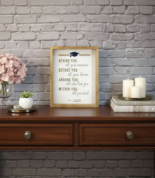 Laser engraved and cut framed wood graduation sign that reads behind you, all  your memories, before you, all your dreams, around you, all who love you, within you, all you need. 
