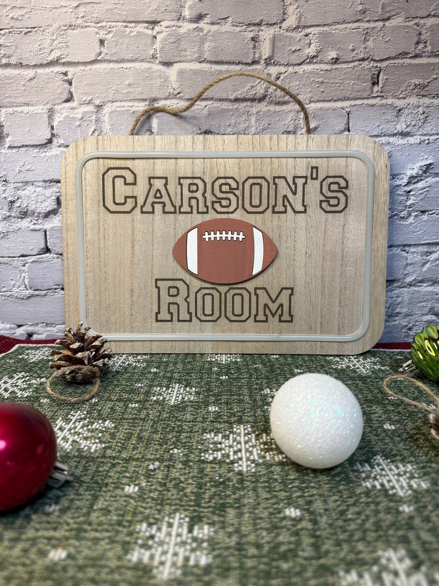 Personalized lighted wood sign laser engraved with a name and a laser cut football