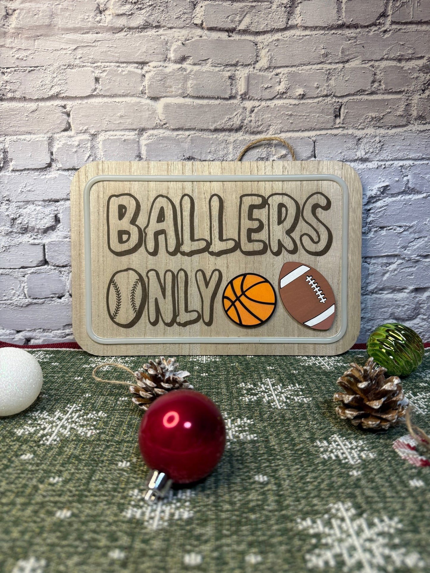 Lighted bedroom sign laser engraved with text ballers only and laser cut sports balls with light off