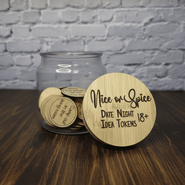 Jar of 'Nice or Spice' date night idea tokens with a wooden disc on a wooden surface.