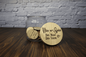 Jar of 'Nice or Spice' date night idea tokens with a wooden disc on a wooden surface.